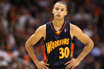 PHOENIX - OCTOBER 30:  Stephen Curry #30 of the Golden State Warriors reacts during the NBA game against the Phoenix Suns during at US Airways Center on October 30, 2009 in Phoenix, Arizona. The Suns defeated the Warriors 123-101.  NOTE TO USER: User expressly acknowledges and agrees that, by downloading and or using this photograph, User is consenting to the terms and conditions of the Getty Images License Agreement.  (Photo by Christian Petersen/Getty Images)