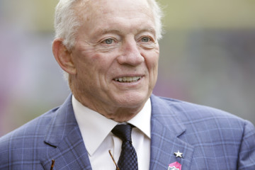 FILE - This is an Oct. 12, 2014, file photo showing Dallas Cowboys owner Jerry Jones standing on the field before an NFL football game against the Seattle Seahawks in Seattle. A judge threw out a sexual assault lawsuit filed against Dallas Cowboys owner Jerry Jones on Thursday, Oct. 16, 2014, saying the claims were barred by Texas law limiting the time in which a case can be filed. (AP Photo/Scott Eklund, File)