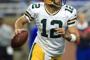 DETROIT, MI - DECEMBER 3: Quarterback Aaron Rodgers #12 of the Green Bay Packers rolls out to pass during the second quarter against the Detroit Lions at Ford Field on December 3, 2015 in Detroit, Michigan. (Photo by Andrew Weber/Getty Images)
